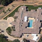 Aerial view shows courtyard with pool in center.
